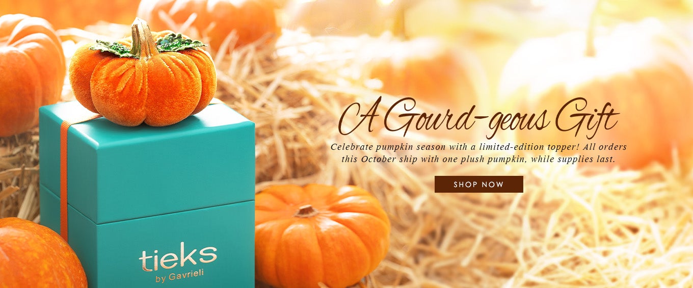 tieks box with a pumpkin box topper surrounded by real pumpkins