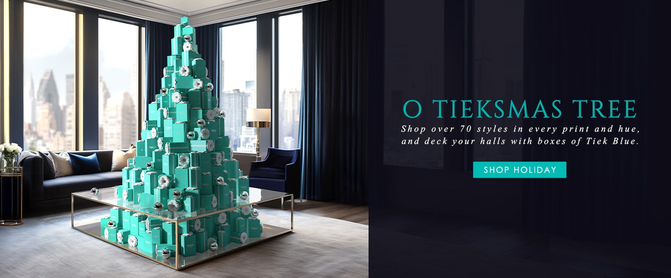 christmas tree made out of tieks boxes in the middle of a living room