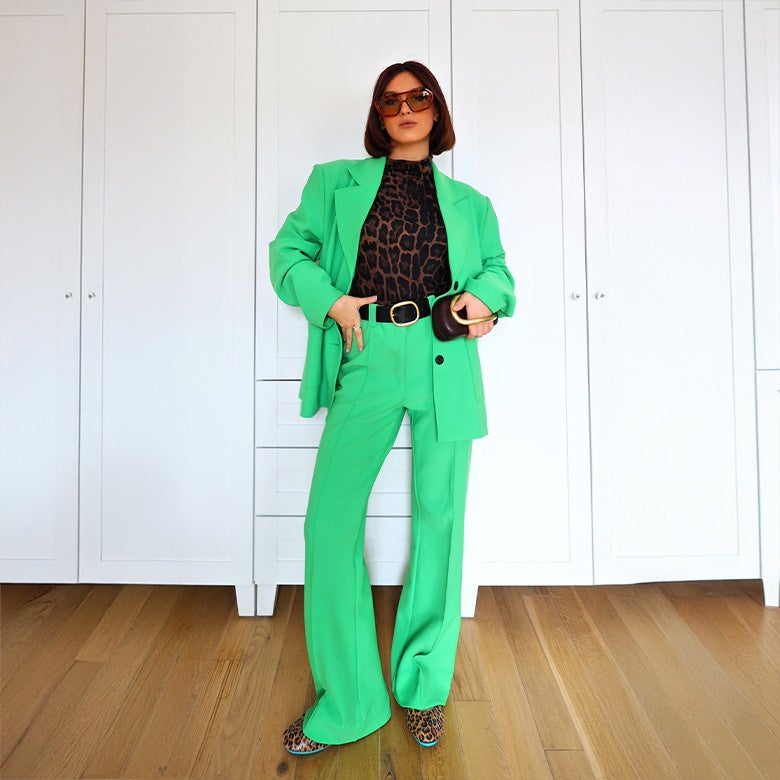 leopard print tieks ballet flats styled with a green suit set